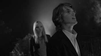 Movie still from “Much Ado About Nothing” (2012), directed by Joss Whedon – A man and a woman standing next to each other; Medium shot, Low angle