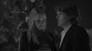 Movie still from “Much Ado About Nothing” (2012), directed by Joss Whedon – A man and a woman standing next to each other; Close Up shot, Over the shoulder angle