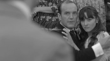 Movie still from “Much Ado About Nothing” (2012), directed by Joss Whedon – A black and white photo of a man and a woman; Close Up shot, Over the shoulder angle