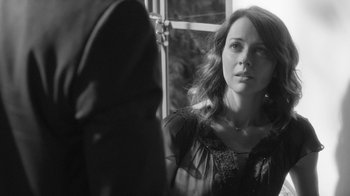 Movie still from “Much Ado About Nothing” (2012), directed by Joss Whedon – Black and white photograph of a woman looking at herself in a mirror; Close Up shot, Over the shoulder angle