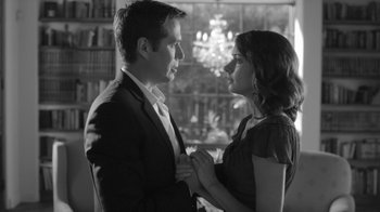 Movie still from “Much Ado About Nothing” (2012), directed by Joss Whedon – A man and a woman standing next to each other; Medium shot, Low angle