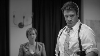 Movie still from “Much Ado About Nothing” (2012), directed by Joss Whedon – A man and a woman standing next to each other in a room; Medium shot, Low angle