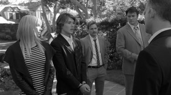 Movie still from “Much Ado About Nothing” (2012), directed by Joss Whedon – A group of men standing next to each other; Medium shot, Over the shoulder angle