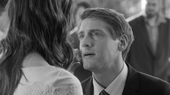 Movie still from “Much Ado About Nothing” (2012), directed by Joss Whedon – A black and white photo of a man and a woman; Close Up shot, Over the shoulder angle