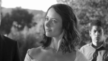 Movie still from “Much Ado About Nothing” (2012), directed by Joss Whedon – Black and white photograph of a woman in a white dress; Close Up shot, Low angle