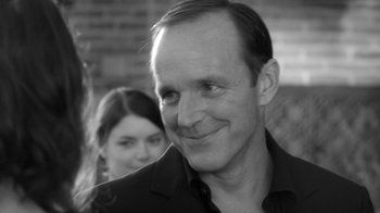 Movie still from “Much Ado About Nothing” (2012), directed by Joss Whedon – A black and white photo of a man and a woman; Close Up shot, Over the shoulder angle