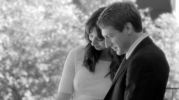 Movie still from “Much Ado About Nothing” (2012), directed by Joss Whedon – A man and a woman standing next to each other; Medium shot, Over the shoulder angle