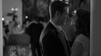 Movie still from “Much Ado About Nothing” (2012), directed by Joss Whedon – A man and a woman smiling at each other; Close Up shot, Over the shoulder angle