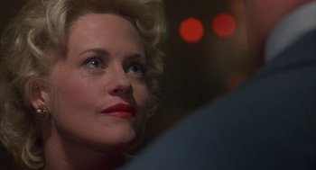 Movie still from “Mulholland Falls” (1996), directed by Lee Tamahori – A person wearing a red lipstick; Close Up shot, Over the shoulder angle