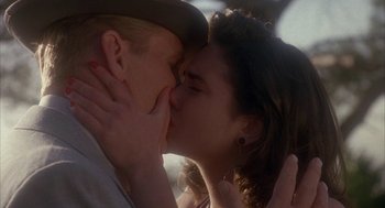 Movie still from “Mulholland Falls” (1996), directed by Lee Tamahori – A man and a woman kissing each other; Close Up shot, Low angle