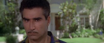 Movie still from “Multiplicity” (1996), directed by Harold Ramis – A person with a mustache; Close Up shot, Low angle