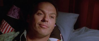 Movie still from “Multiplicity” (1996), directed by Harold Ramis – A person laying in a bed; Close Up shot, Low angle