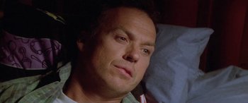 Movie still from “Multiplicity” (1996), directed by Harold Ramis – A man's face as he stares into the distance; Close Up shot, High angle