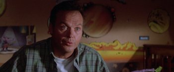 Movie still from “Multiplicity” (1996), directed by Harold Ramis – A person wearing a plaid shirt; Close Up shot, Low angle