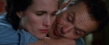 Movie still from “Multiplicity” (1996), directed by Harold Ramis – A woman and a man are hugging each other; Close Up shot, Low angle
