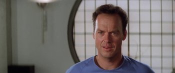 Movie still from “Multiplicity” (1996), directed by Harold Ramis – A person wearing a blue t - shirt; Close Up shot, Low angle