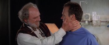 Movie still from “Multiplicity” (1996), directed by Harold Ramis – A man touching another man's face with his hands; Close Up shot, Over the shoulder angle