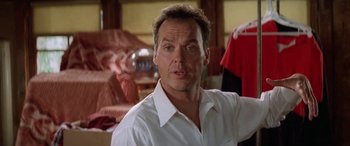 Movie still from “Multiplicity” (1996), directed by Harold Ramis – A person wearing a white shirt; Close Up shot, Low angle