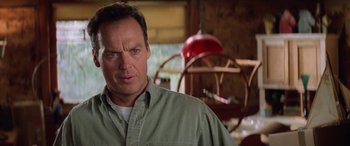 Movie still from “Multiplicity” (1996), directed by Harold Ramis – A person wearing a green shirt; Close Up shot, Low angle