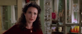 Movie still from “Multiplicity” (1996), directed by Harold Ramis – A person with curly hair wearing a necklace; Close Up shot, Over the shoulder angle