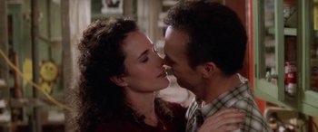 Movie still from “Multiplicity” (1996), directed by Harold Ramis – A man and a woman are kissing in a room; Close Up shot, Low angle