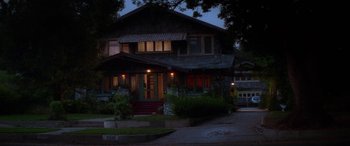 Movie still from “Multiplicity” (1996), directed by Harold Ramis – A house that is lit up at night time; Extreme Wide shot, High angle