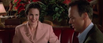 Movie still from “Multiplicity” (1996), directed by Harold Ramis – A man and a woman sitting at a table; Close Up shot, Over the shoulder angle