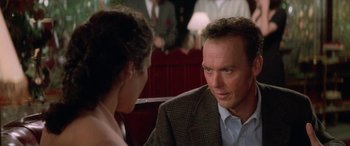 Movie still from “Multiplicity” (1996), directed by Harold Ramis – A man and a woman sitting at a table talking to each other; Close Up shot, Over the shoulder angle