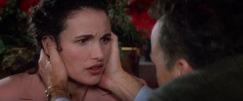 Movie still from “Multiplicity” (1996), directed by Harold Ramis – A man touching the ear of a beautiful woman; Close Up shot, Over the shoulder angle