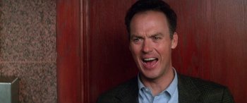 Movie still from “Multiplicity” (1996), directed by Harold Ramis – A man that is laughing at something; Close Up shot, Low angle