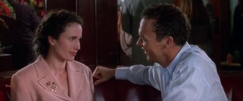 Movie still from “Multiplicity” (1996), directed by Harold Ramis – A man and a woman sitting at a table talking to each other; Close Up shot, Over the shoulder angle