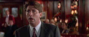 Movie still from “Multiplicity” (1996), directed by Harold Ramis – A person wearing a suit and tie; Close Up shot, Low angle