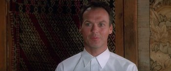 Movie still from “Multiplicity” (1996), directed by Harold Ramis – A person wearing a white shirt; Close Up shot, Low angle