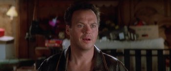 Movie still from “Multiplicity” (1996), directed by Harold Ramis – A person wearing a leather jacket; Close Up shot, Over the shoulder angle