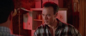 Movie still from “Multiplicity” (1996), directed by Harold Ramis – A person wearing a plaid shirt; Close Up shot, Low angle