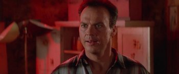 Movie still from “Multiplicity” (1996), directed by Harold Ramis – A person wearing a plaid shirt; Close Up shot, Low angle