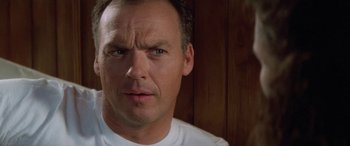 Movie still from “Multiplicity” (1996), directed by Harold Ramis – A man's face in front of a wooden wall; Close Up shot, Low angle