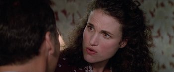 Movie still from “Multiplicity” (1996), directed by Harold Ramis – A person with curly hair; Close Up shot, Over the shoulder angle