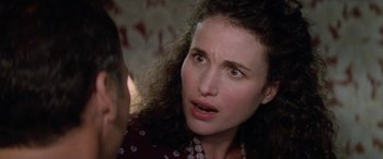 Movie still from “Multiplicity” (1996), directed by Harold Ramis – A person with curly hair; Close Up shot, Over the shoulder angle