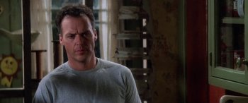 Movie still from “Multiplicity” (1996), directed by Harold Ramis – A person wearing a shirt; Close Up shot, Low angle