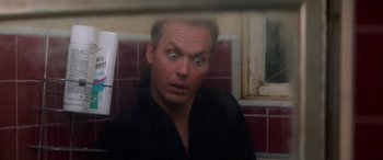 Movie still from “Multiplicity” (1996), directed by Harold Ramis – A person with his eyes wide open; Close Up shot, Low angle
