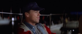 Movie still from “Multiplicity” (1996), directed by Harold Ramis – A person wearing a hat; Close Up shot, Over the shoulder angle