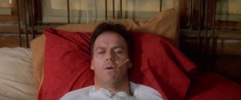 Movie still from “Multiplicity” (1996), directed by Harold Ramis – A man laying in a bed with his mouth open; Close Up shot, Overhead angle