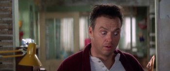 Movie still from “Multiplicity” (1996), directed by Harold Ramis – A person wearing a sweater; Close Up shot, Low angle