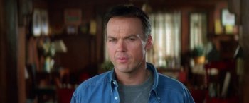 Movie still from “Multiplicity” (1996), directed by Harold Ramis – A person wearing a blue shirt; Close Up shot, Low angle