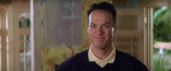 Movie still from “Multiplicity” (1996), directed by Harold Ramis – A person wearing a shirt and tie smiling; Close Up shot, Low angle