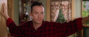 Movie still from “Multiplicity” (1996), directed by Harold Ramis – A person wearing a red shirt; Close Up shot, Over the shoulder angle