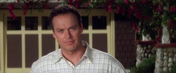 Movie still from “Multiplicity” (1996), directed by Harold Ramis – A person wearing a plaid shirt; Close Up shot, Over the shoulder angle