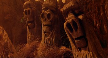 Movie still from “Muppet Treasure Island” (1996), directed by David Lane – A group of carved faces; Close Up shot, Low angle