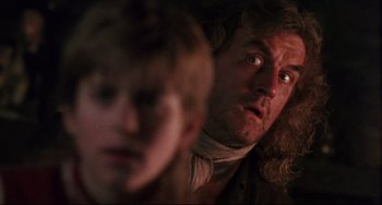 Movie still from “Muppet Treasure Island” (1996), directed by David Lane – A person with a man in the background; Close Up shot, Over the shoulder angle